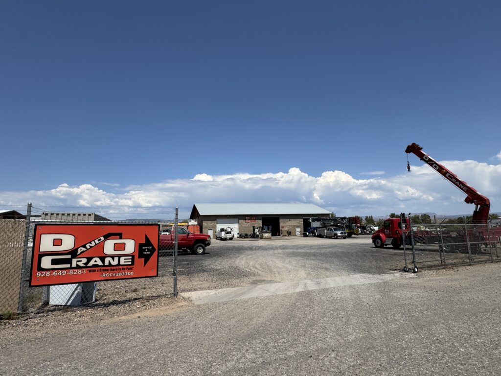 D&O Crane yard in Northern Arizona with cranes, trucks, and equipment ready for rental services.