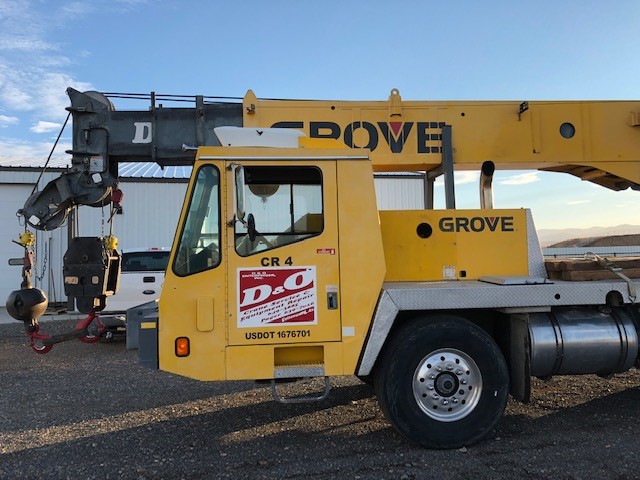 Yellow Grove crane truck with D&O Crane logo, used for lifting and rental services in Prescott AZ.