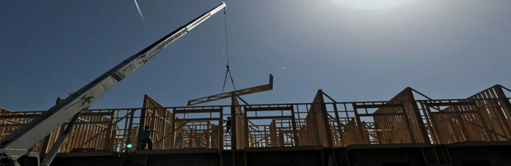 D&O Crane lifting roof truss with boom truck for residential construction in Northern Arizona.